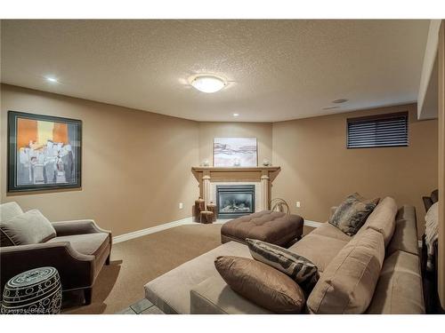 49-655 Park Road N, Brantford, ON - Indoor Photo Showing Basement With Fireplace