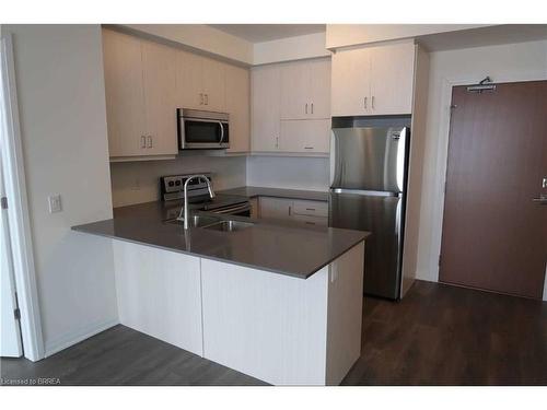 329-1105 Leger Way, Milton, ON - Indoor Photo Showing Kitchen With Stainless Steel Kitchen With Double Sink