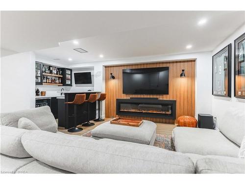 20 Cumberland Street, Brantford, ON - Indoor Photo Showing Living Room With Fireplace