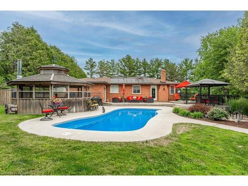 6954 Fife Road, Guelph/Eramosa, ON - Outdoor With In Ground Pool With Deck Patio Veranda With Backyard