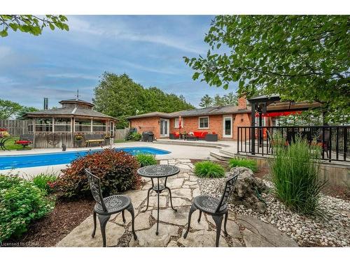 6954 Fife Road, Guelph/Eramosa, ON - Outdoor With In Ground Pool With Deck Patio Veranda With Backyard