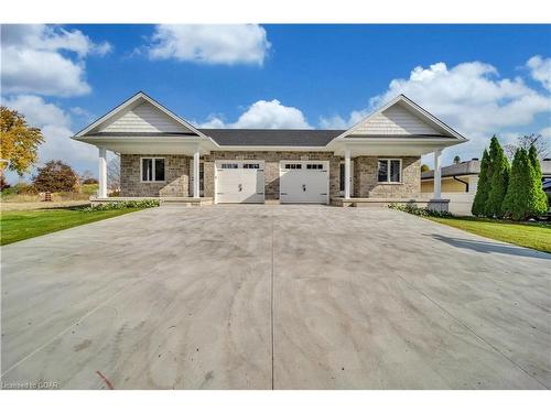 211 Queen Street S, Harriston, ON - Outdoor With Facade