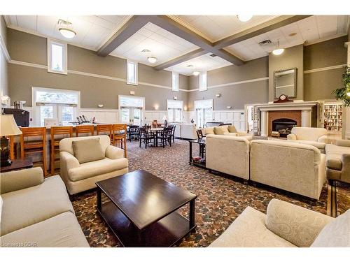 407-65 Bayberry Drive, Guelph, ON - Indoor Photo Showing Living Room With Fireplace