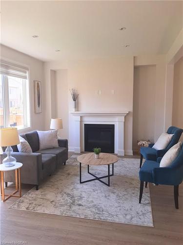 149 Harpin Way E, Fergus, ON - Indoor Photo Showing Living Room With Fireplace