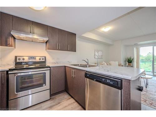 206-7 Kay Crescent, Guelph, ON - Indoor Photo Showing Kitchen With Stainless Steel Kitchen With Double Sink