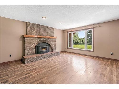 12297 25 Highway, Halton Hills, ON - Indoor Photo Showing Living Room With Fireplace