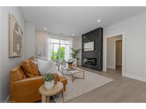 301-71 Wyndham Street S, Guelph, ON - Indoor Photo Showing Living Room With Fireplace