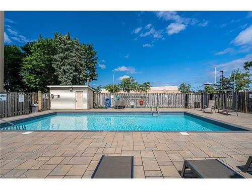 309-700 Dynes Road, Burlington, ON - Outdoor With In Ground Pool With Backyard