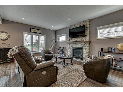 587 Hawthorne Place, Woodstock, ON - Indoor Photo Showing Living Room With Fireplace