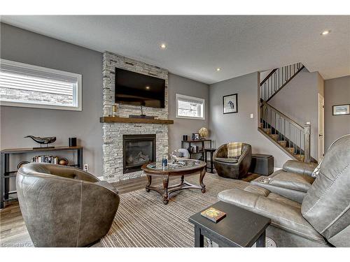 587 Hawthorne Place, Woodstock, ON - Indoor Photo Showing Living Room With Fireplace