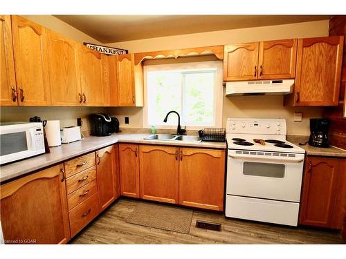 82 Mcivor Drive, Miller Lake, ON - Indoor Photo Showing Kitchen With Double Sink