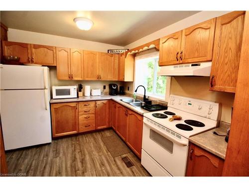 82 Mcivor Drive, Miller Lake, ON - Indoor Photo Showing Kitchen With Double Sink