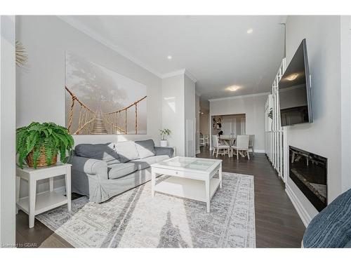 201-1880 Gordon Street, Guelph, ON - Indoor Photo Showing Living Room With Fireplace