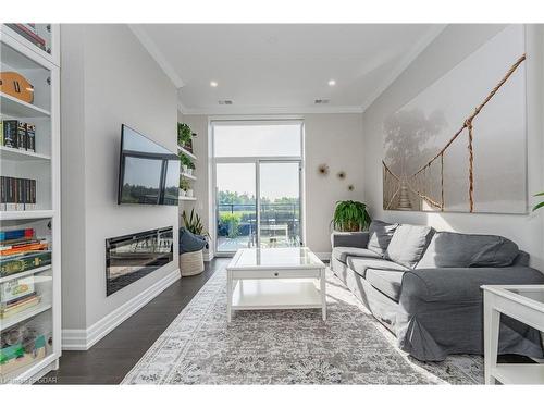 201-1880 Gordon Street, Guelph, ON - Indoor Photo Showing Living Room With Fireplace