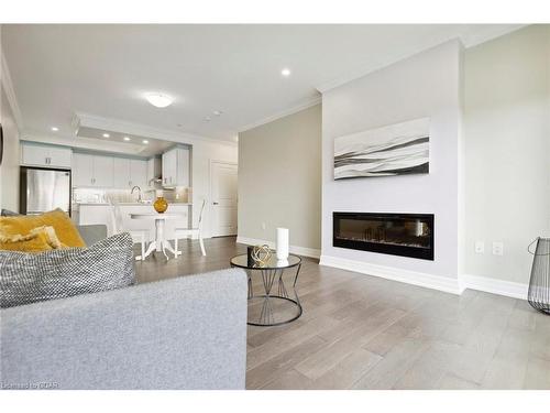 308-1878 Gordon Street, Guelph, ON - Indoor Photo Showing Living Room With Fireplace