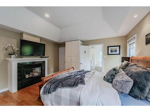 7568 Marden Road, Guelph/Eramosa, ON - Indoor Photo Showing Bedroom With Fireplace