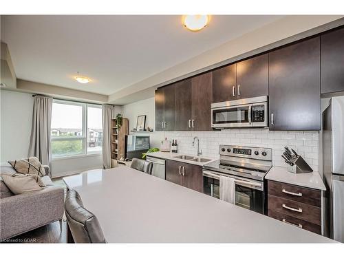 304-1105 Leger Way, Milton, ON - Indoor Photo Showing Kitchen With Stainless Steel Kitchen With Double Sink