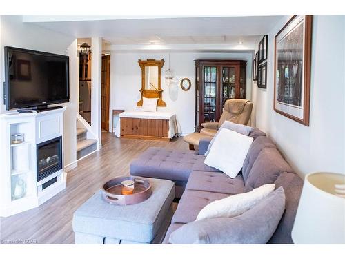 14-31 Schroder Crescent, Guelph, ON - Indoor Photo Showing Living Room With Fireplace