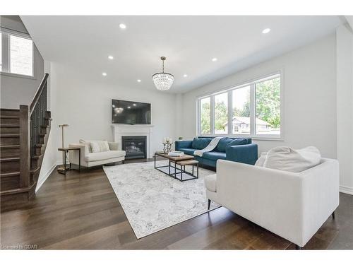 64 Harpin Way East, Fergus, ON - Indoor Photo Showing Living Room With Fireplace