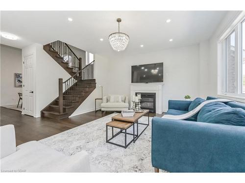 64 Harpin Way East, Fergus, ON - Indoor Photo Showing Living Room With Fireplace