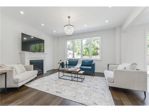 64 Harpin Way East, Fergus, ON - Indoor Photo Showing Living Room With Fireplace