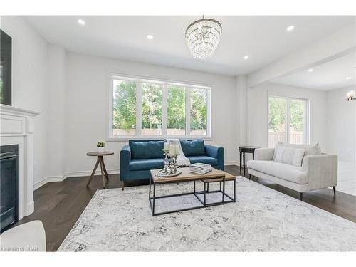 64 Harpin Way East, Fergus, ON - Indoor Photo Showing Living Room With Fireplace