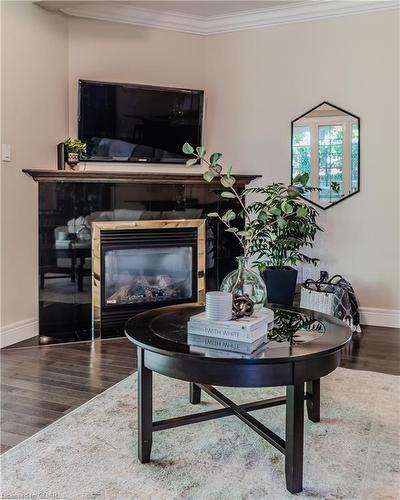 18-255 Summerfield Drive, Guelph, ON - Indoor Photo Showing Living Room With Fireplace