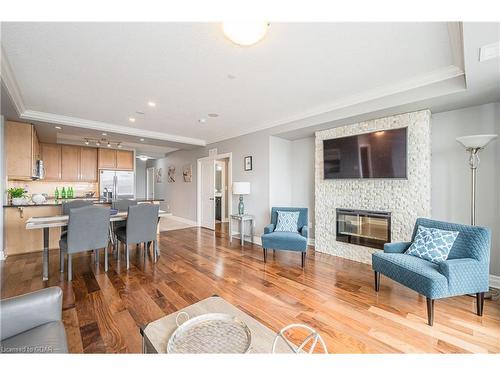 901-150 Wellington Street E, Guelph, ON - Indoor Photo Showing Living Room With Fireplace