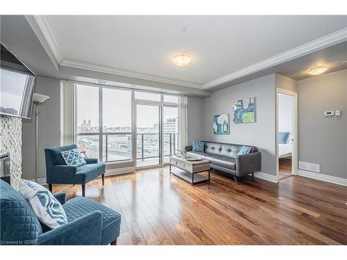 901-150 Wellington Street E, Guelph, ON - Indoor Photo Showing Living Room With Fireplace