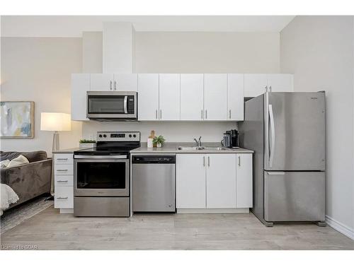 1109-716 Main Street East, Milton, ON - Indoor Photo Showing Kitchen With Double Sink