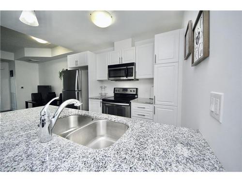 110-17 Kay Crescent, Guelph, ON - Indoor Photo Showing Kitchen With Stainless Steel Kitchen With Double Sink