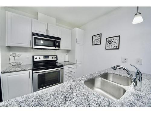 110-17 Kay Crescent, Guelph, ON - Indoor Photo Showing Kitchen With Stainless Steel Kitchen With Double Sink