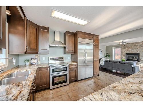 40 Ingram Drive, Guelph, ON - Indoor Photo Showing Kitchen With Fireplace With Double Sink