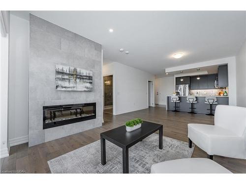 709-1878 Gordon Street, Guelph, ON - Indoor Photo Showing Living Room With Fireplace