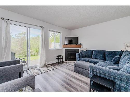 7-601 Columbia Forest Boulevard, Waterloo, ON - Indoor Photo Showing Living Room With Fireplace