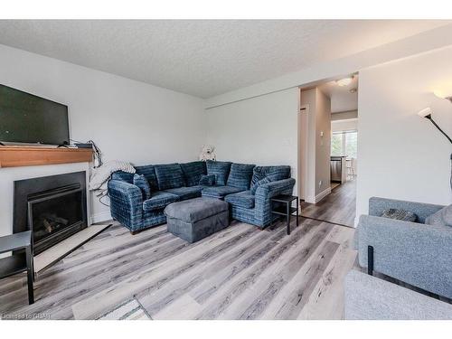 7-601 Columbia Forest Boulevard, Waterloo, ON - Indoor Photo Showing Living Room With Fireplace