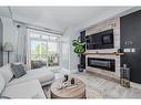 108-2 Colonial Drive, Guelph, ON  - Indoor Photo Showing Living Room With Fireplace 