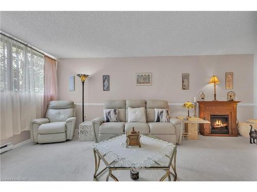 206-93 Westwood Road, Guelph, ON - Indoor Photo Showing Living Room With Fireplace