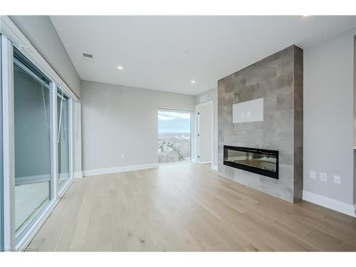 1207-71 Wyndham Street S, Guelph, ON - Indoor Photo Showing Living Room With Fireplace