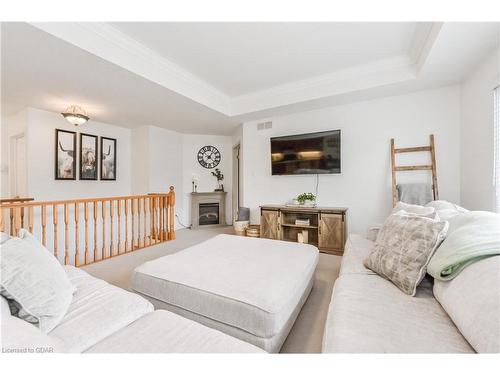 115 Andrews Dr W, Drayton, ON - Indoor Photo Showing Bedroom With Fireplace