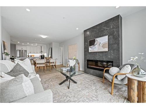 411-71 Wyndham Street S, Guelph, ON - Indoor Photo Showing Living Room With Fireplace