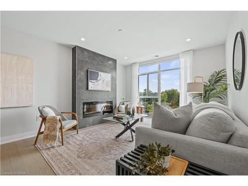 411-71 Wyndham Street S, Guelph, ON - Indoor Photo Showing Living Room With Fireplace