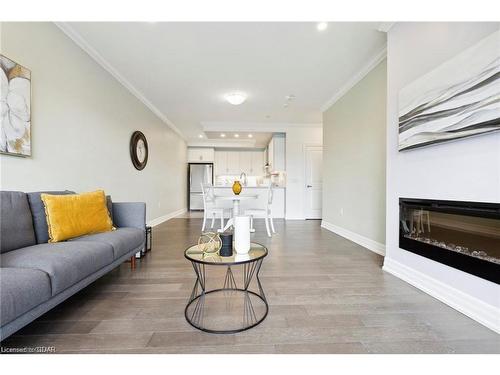 308-1878 Gordon Street, Guelph, ON - Indoor Photo Showing Living Room With Fireplace