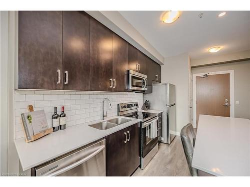 304-1105 Leger Way, Milton, ON - Indoor Photo Showing Kitchen With Stainless Steel Kitchen With Double Sink With Upgraded Kitchen