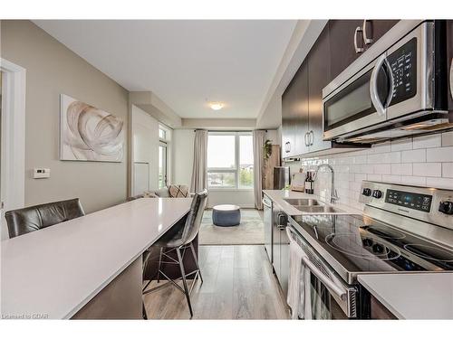 304-1105 Leger Way, Milton, ON - Indoor Photo Showing Kitchen With Stainless Steel Kitchen With Double Sink