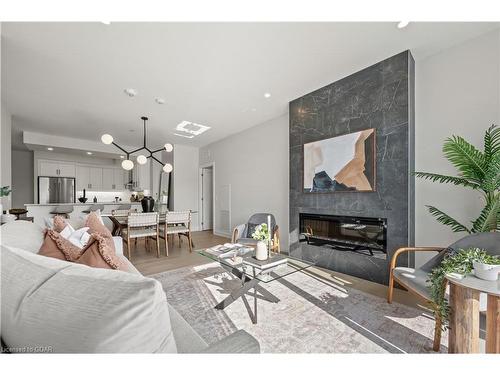 313-71 Wyndham Street S, Guelph, ON - Indoor Photo Showing Living Room With Fireplace