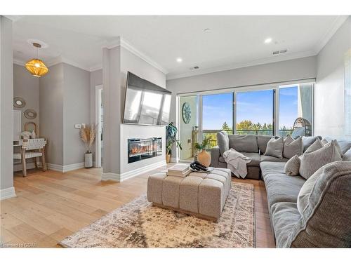 406-1880 Gordon Street, Guelph, ON - Indoor Photo Showing Living Room With Fireplace