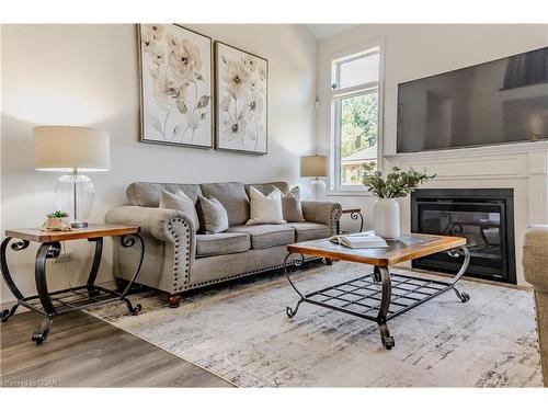 116 Harpin Way E, Fergus, ON - Indoor Photo Showing Living Room With Fireplace