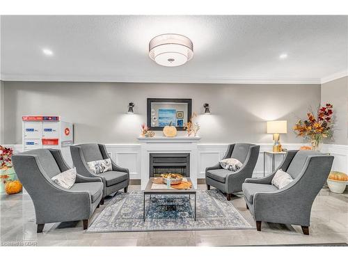 311-60 Wyndham Street S, Guelph, ON - Indoor Photo Showing Living Room With Fireplace