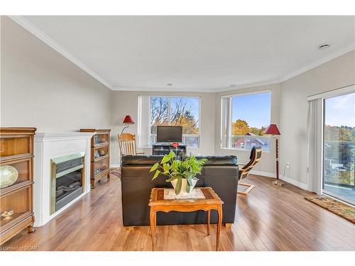 311-60 Wyndham Street S, Guelph, ON - Indoor Photo Showing Living Room With Fireplace